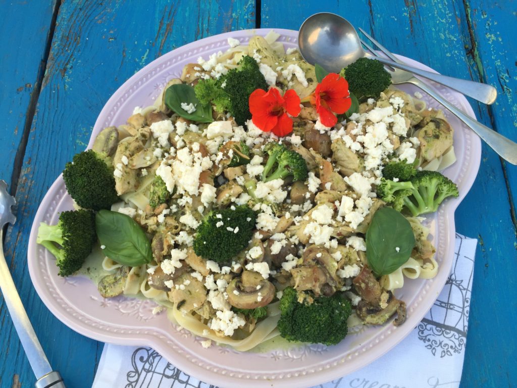 creamy basil pesto chicken mushrooms and brocoli served on tagliatelle