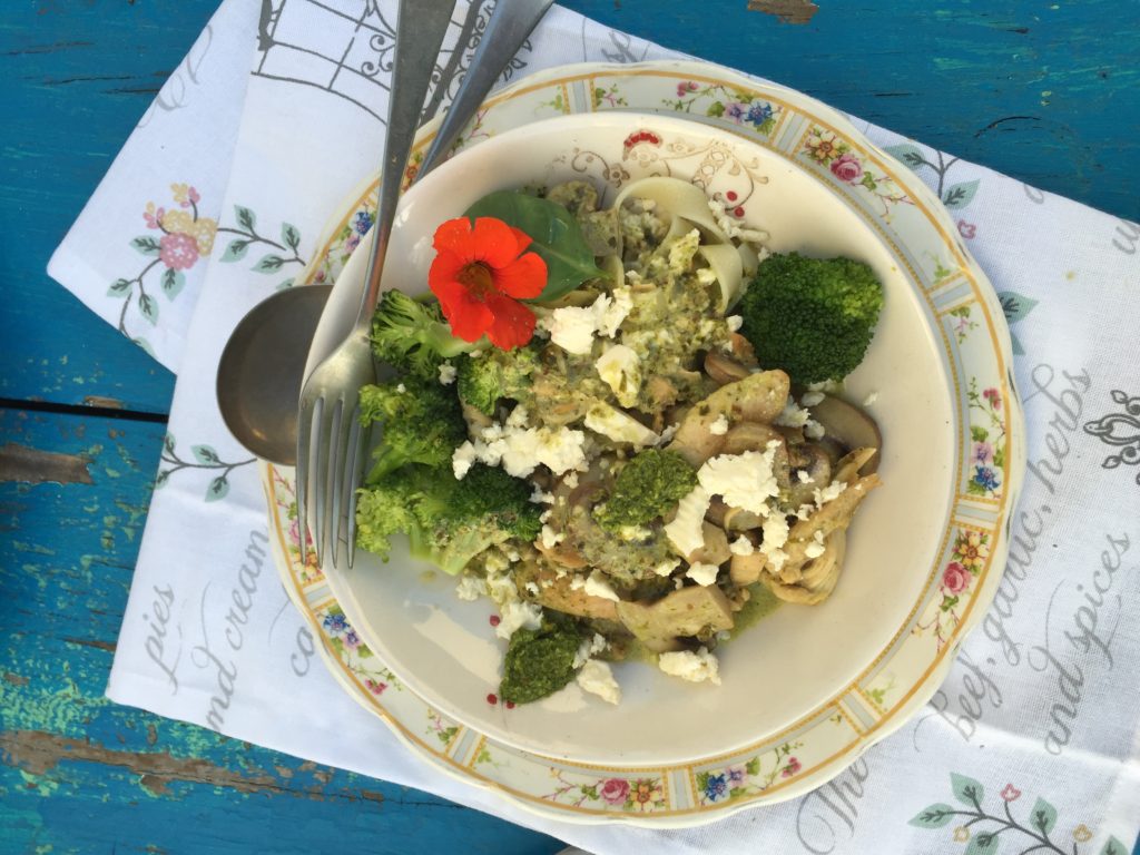 Single portion of tagliatelle with chicken, mushrooms and broccoli in a creamy basil sauce